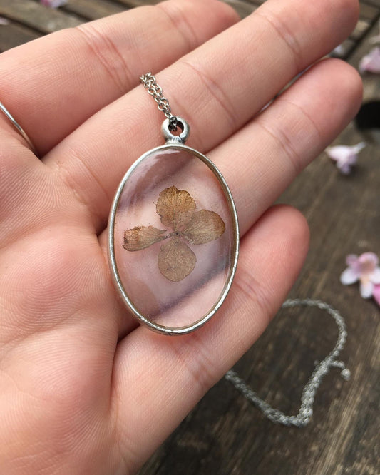 oval necklace with earthy brown skeleton Hydrangea