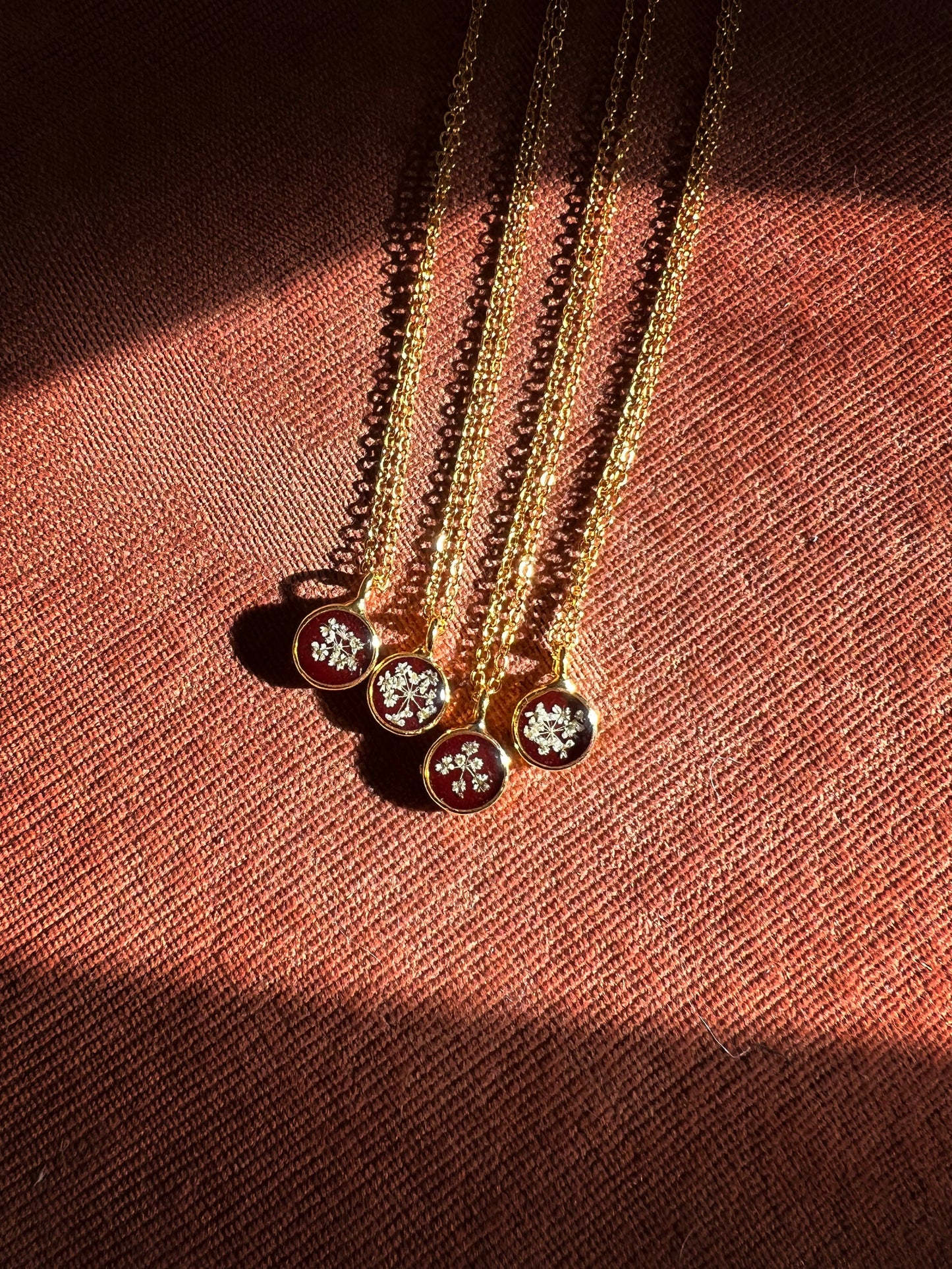 Burgundy necklace with pressed Queen Anne's Lace