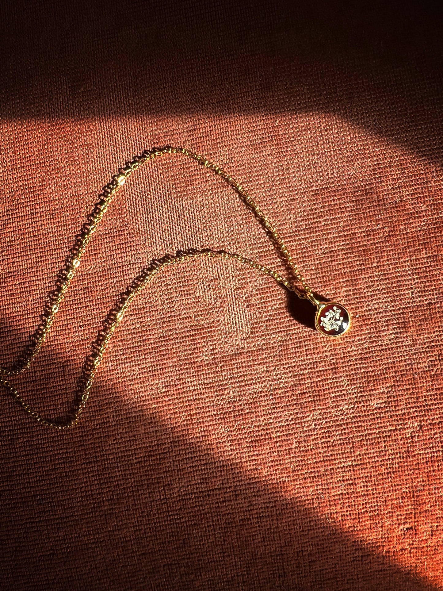 Burgundy necklace with pressed Queen Anne's Lace