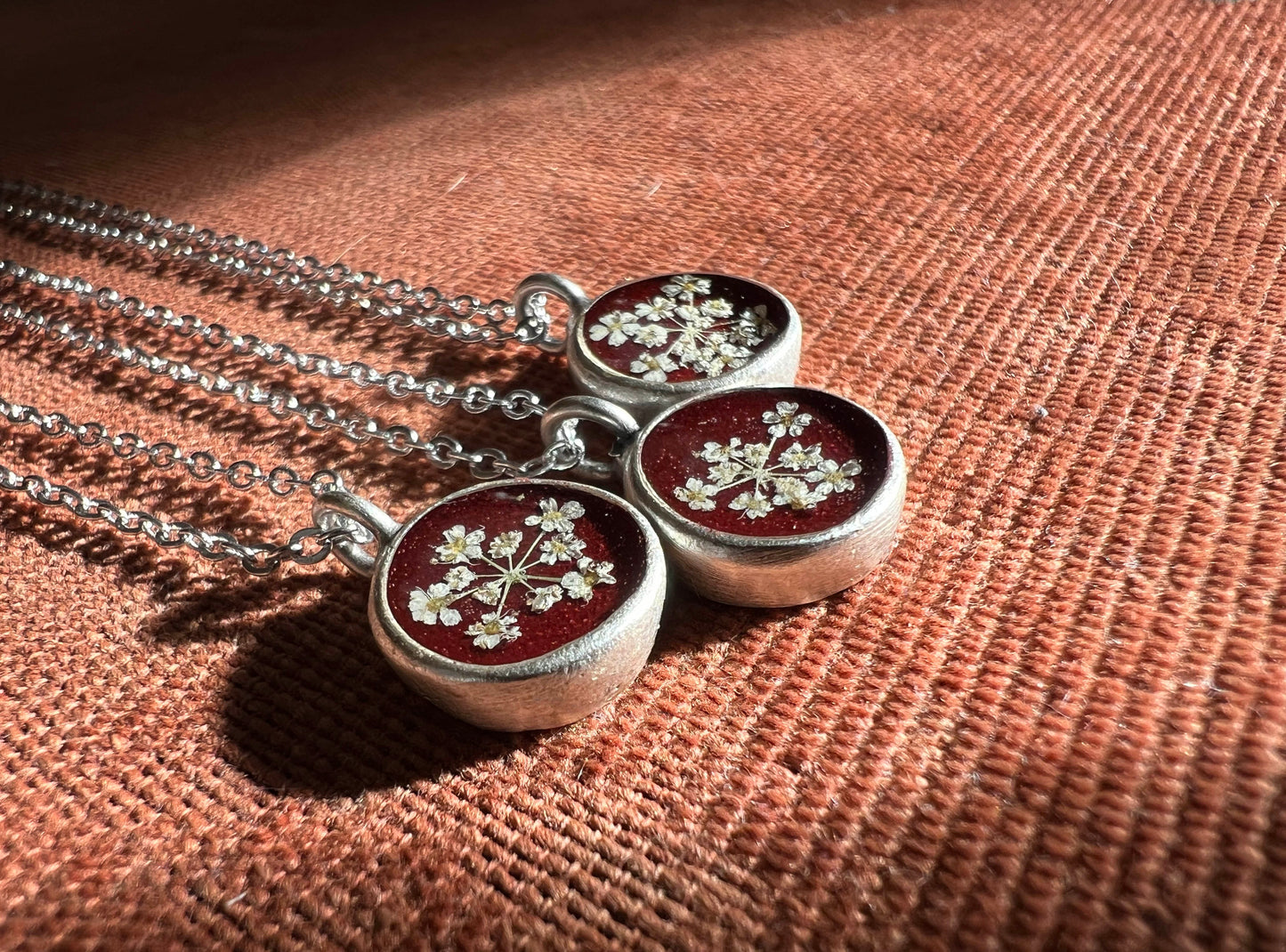 Burgundy necklace with pressed Queen Anne's Lace