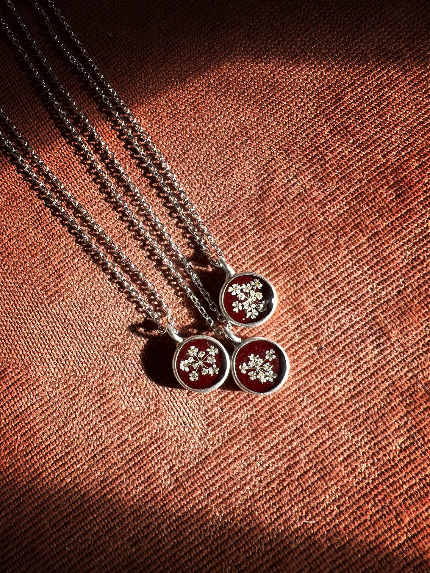 Burgundy necklace with pressed Queen Anne's Lace