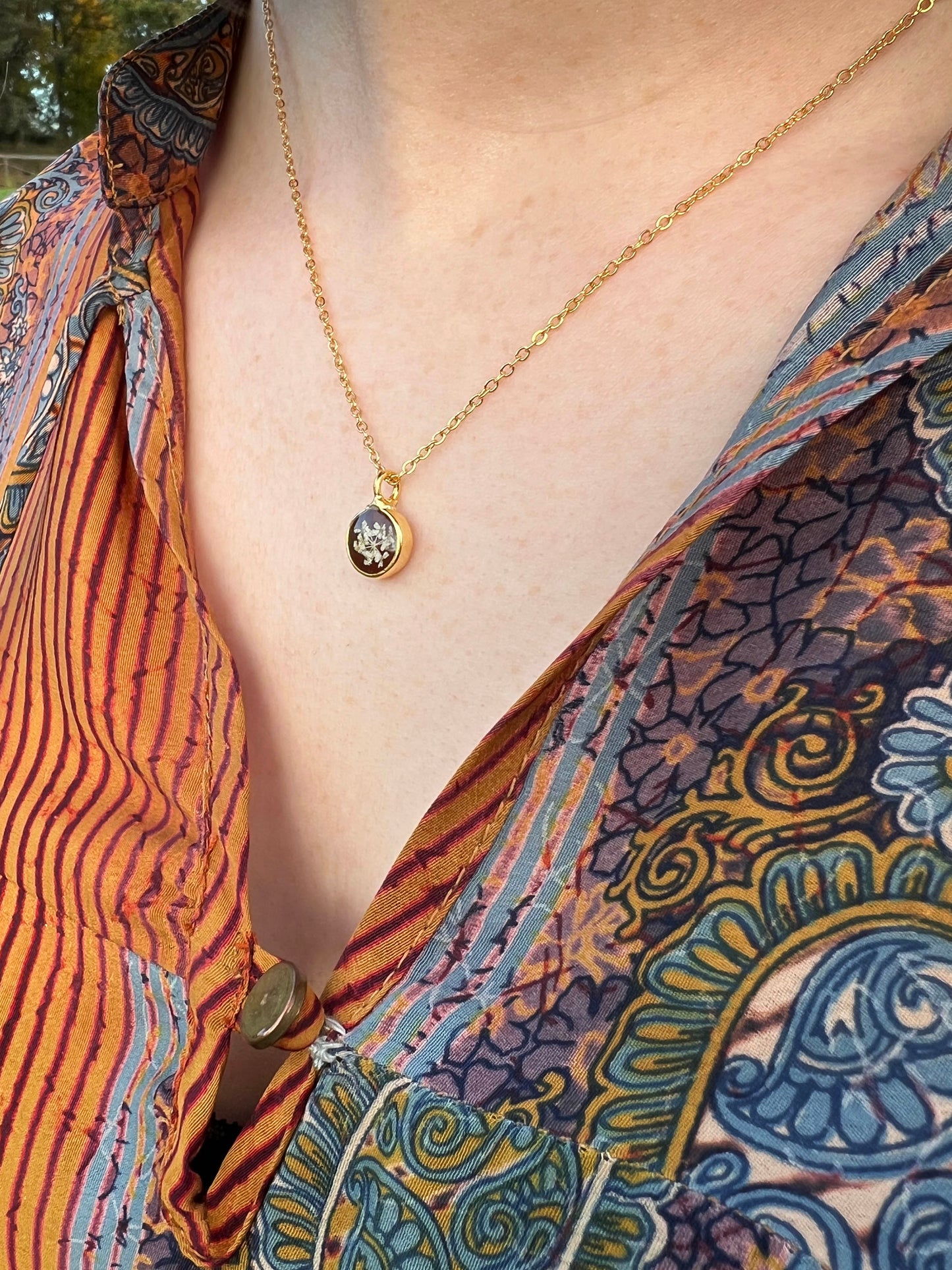 Burgundy necklace with pressed Queen Anne's Lace